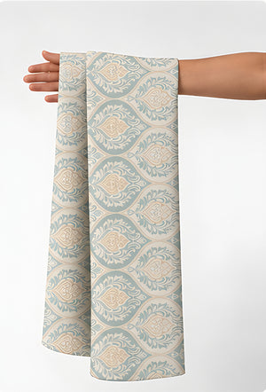 Cream Diamond Lattice silk held in hand for scale