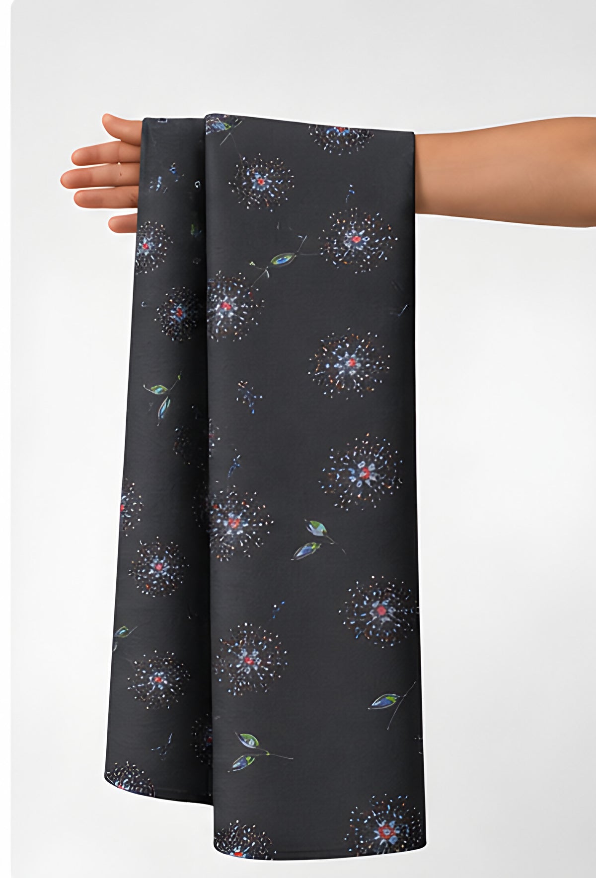 Charcoal Subtle Starburst chiffon held in hand for scale