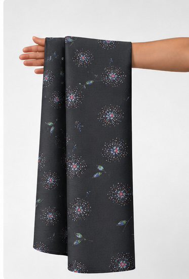 Charcoal Subtle Starburst chiffon held in hand for scale
