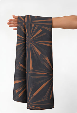 Brown Geometric Starburst chiffon held in hand for scale