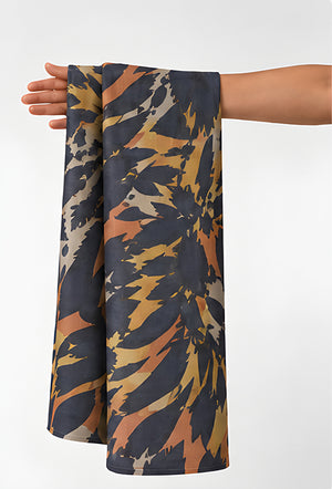 Tan Navy Abstract Animal Print chiffon held in hand for scale