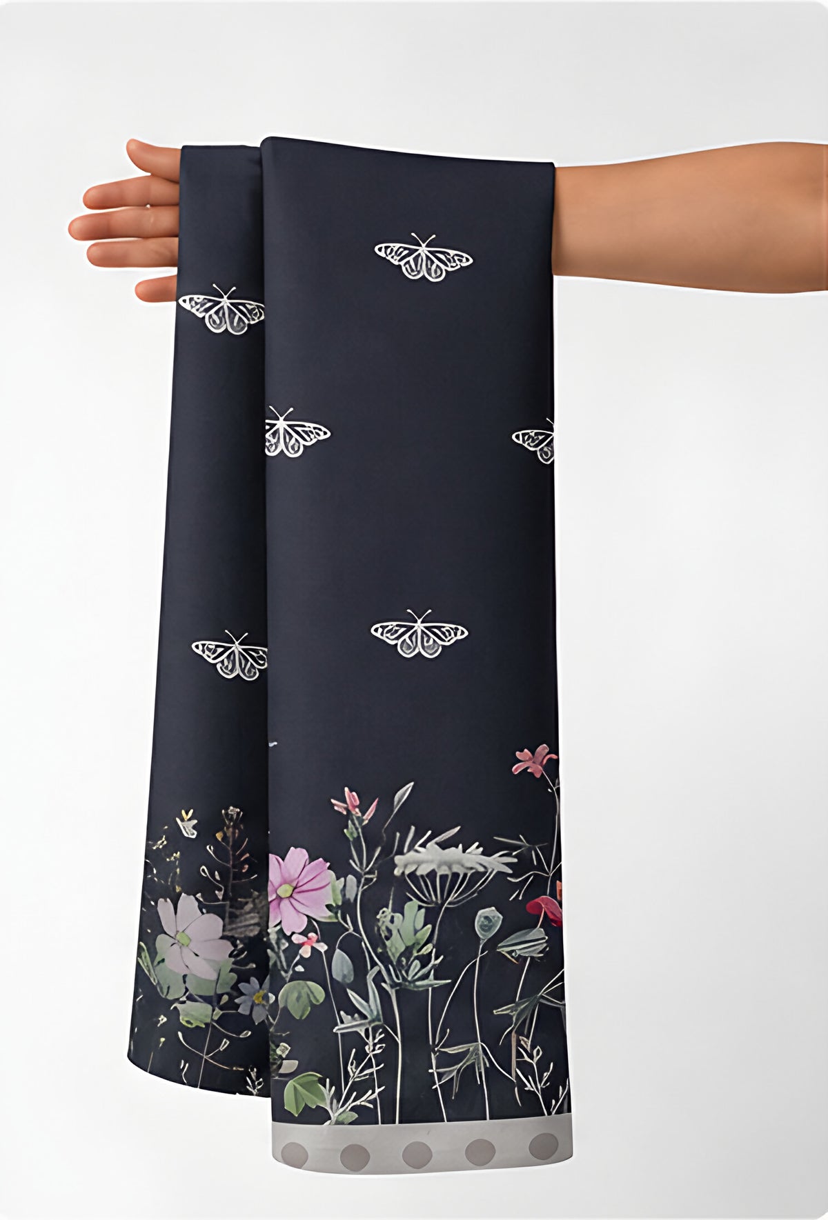 Charcoal Floral Border Print chiffon held in hand for scale