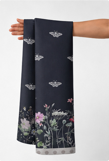 Charcoal Floral Border Print chiffon held in hand for scale