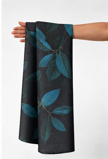 Black Teal Leaf Print chiffon held in hand for scale