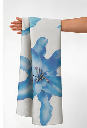 Ivory Blue Lily Print chiffon held in hand for scale