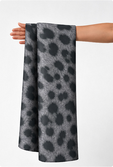 Grey Leopard Spot chiffon held in hand for scale