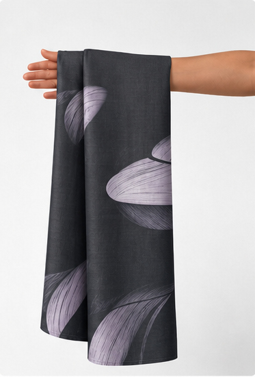 Charcoal Grey Botanical Leaves chiffon held in hand for scale