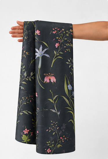 Black Delicate Meadow Florals chiffon held in hand for scale