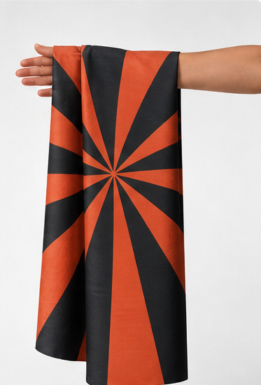 Orange Black Sunburst Geometry chiffon held in hand for scale