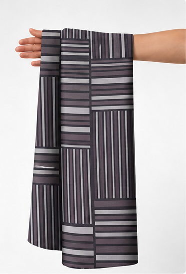 Charcoal Mixed Stripe Patchwork chiffon held in hand for scale