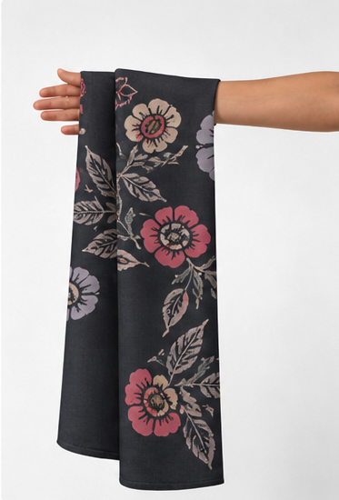 Colorful Folk Floral on Black crepe held in hand for scale