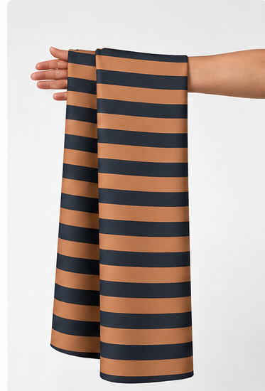 Rust and Navy Bold Stripes crepe held in hand for scale