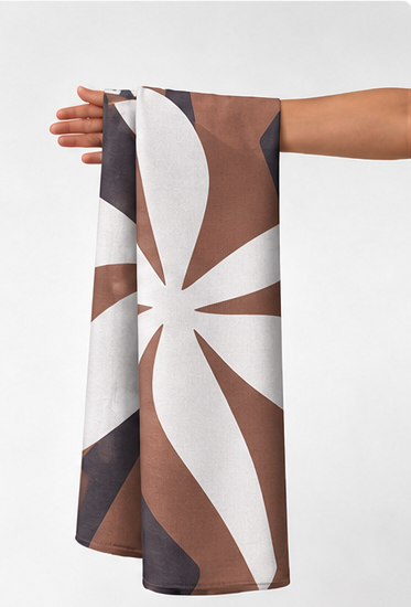 Brown Ivory Swirl Abstract crepe held in hand for scale