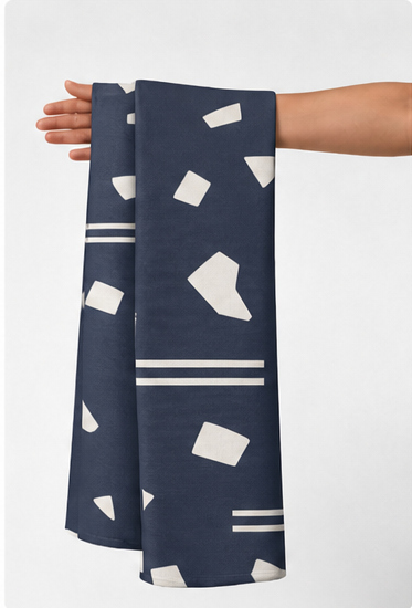 Ivory Abstract Confetti on Navy crepe held in hand for scale