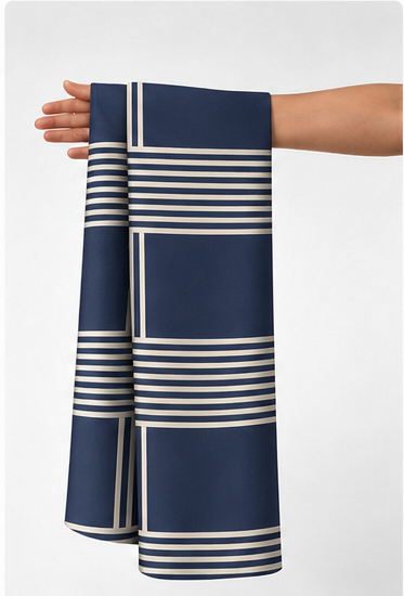 Navy Ivory Grid Stripes crepe held in hand for scale