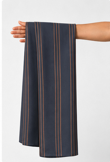 Charcoal Copper Fine Stripes crepe held in hand for scale