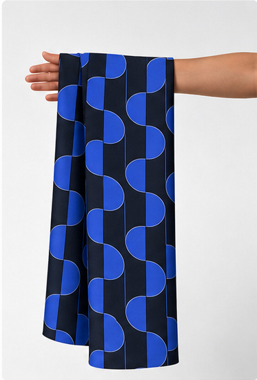 Deep Blue Printed Crepe 053 crepe held in hand for scale