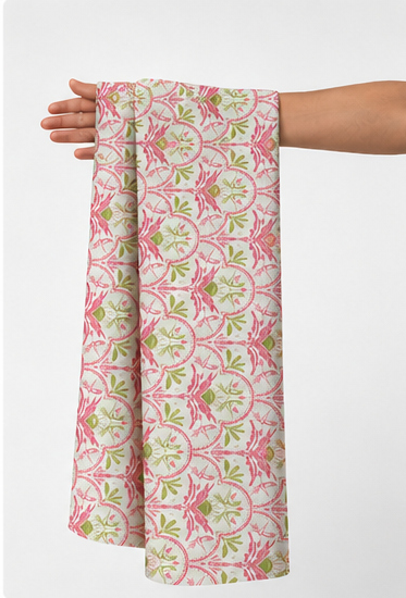 Pink and Green Botanical Scroll poly-cotton held in hand for scale