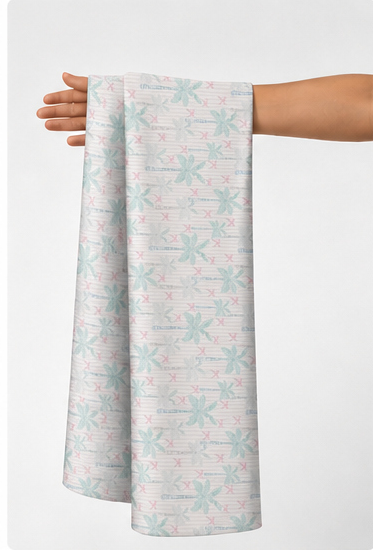 Mint Green Delicate Botanical poly-cotton held in hand for scale