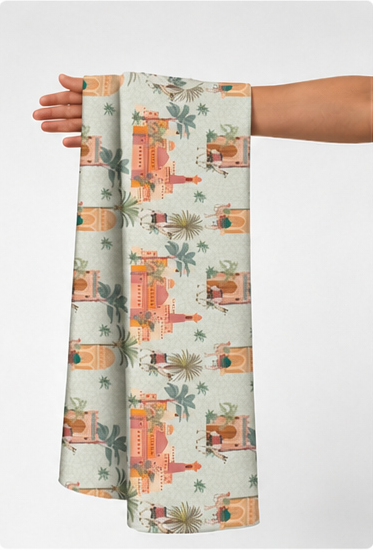 Peach Tropical Patchwork poly-cotton held in hand for scale