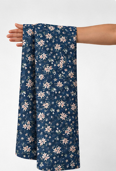 Navy Blue Mini Daisies poly-cotton held in hand for scale