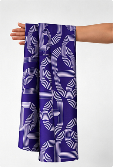 Violet Geometric Loops poly-cotton held in hand for scale