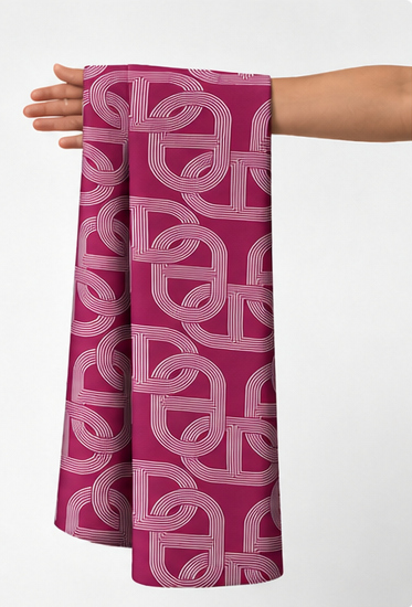 Magenta Geometric Loops poly-cotton held in hand for scale