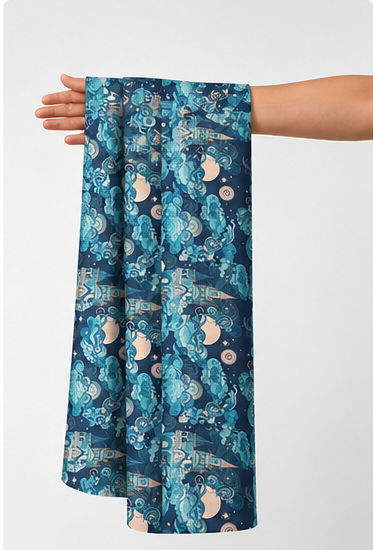 Deep Teal Botanical Blooms poly-cotton held in hand for scale