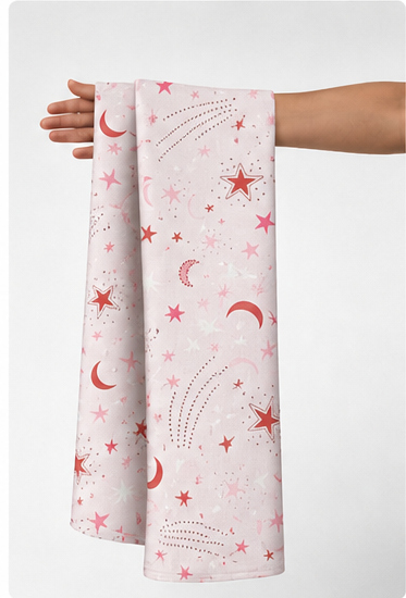 Pink Celestial Moons poly-cotton held in hand for scale