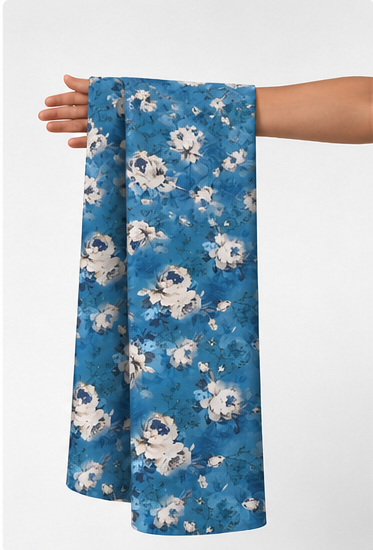 Denim Blue White Florals poly-cotton held in hand for scale