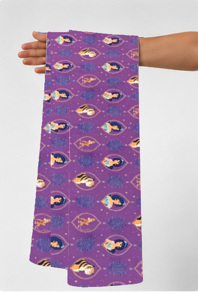 Purple Playful Fish Motifs poly-cotton held in hand for scale