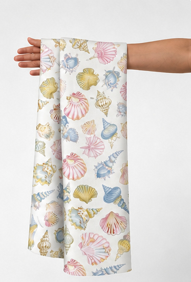 Pastel Seashell Print poly-cotton held in hand for scale