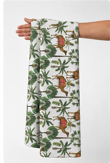 White Tropical Birds and Leaves poly-cotton held in hand for scale