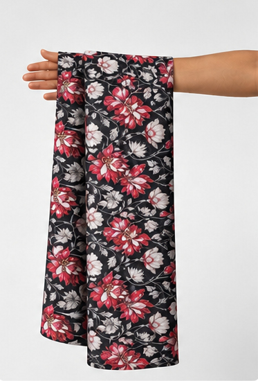 Black Red and Pink Floral poly-cotton held in hand for scale