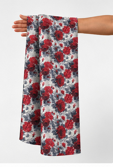 Light Blue Red Floral poly-cotton held in hand for scale