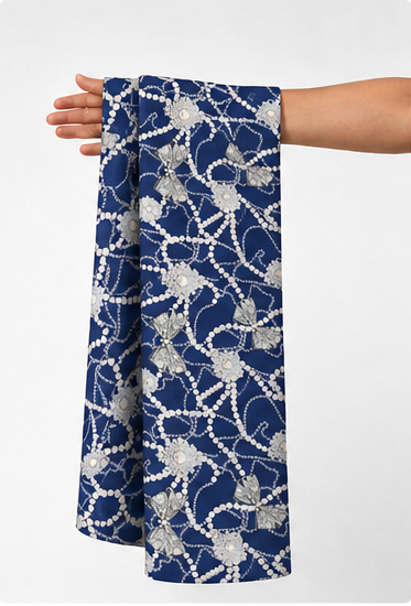 Indigo White Branch Pattern poly-cotton held in hand for scale