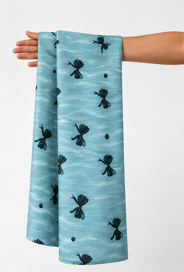 Aqua Black Tiny Floral poly-cotton held in hand for scale