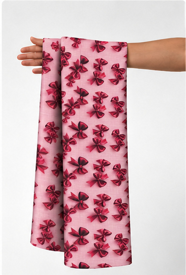 Bright Pink Burgundy Floral poly-cotton held in hand for scale