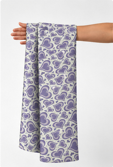 Lavender Ornamental Paisley poly-cotton held in hand for scale