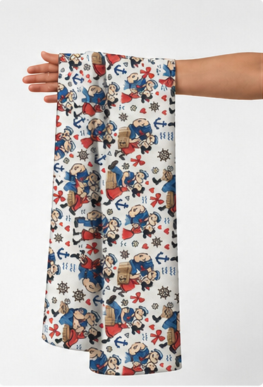 White Colorful Illustrated Motifs poly-cotton held in hand for scale