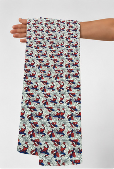 White Multicolor Bird Print poly-cotton held in hand for scale