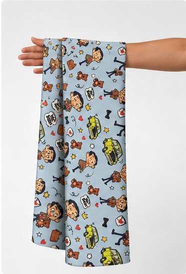 Sky Blue Cartoon Animal Print poly-cotton held in hand for scale