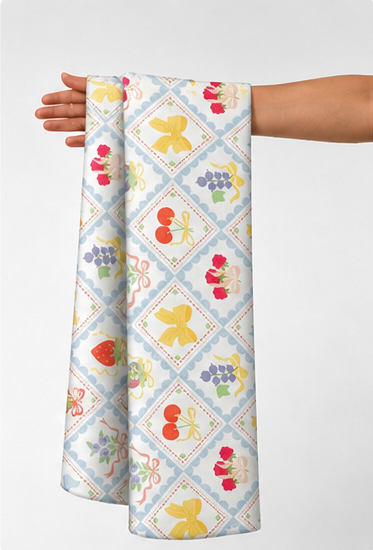 Blue Yellow Diamond Folk Floral poly-cotton held in hand for scale