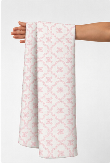 Blush Faint Geometric Rosettes poly-cotton held in hand for scale