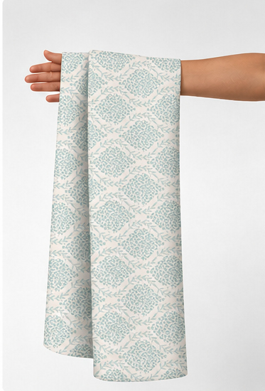 Ivory Soft Geometric silk held in hand for scale