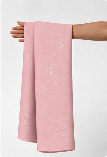 Solid Blush Pink silk held in hand for scale