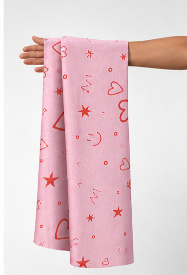Pink Hearts and Doodles silk held in hand for scale