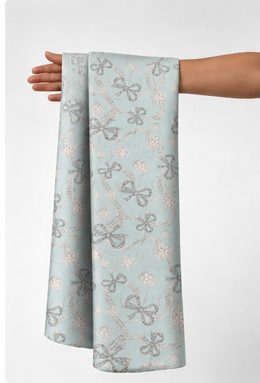 Misty Blue Floral Sketch silk held in hand for scale