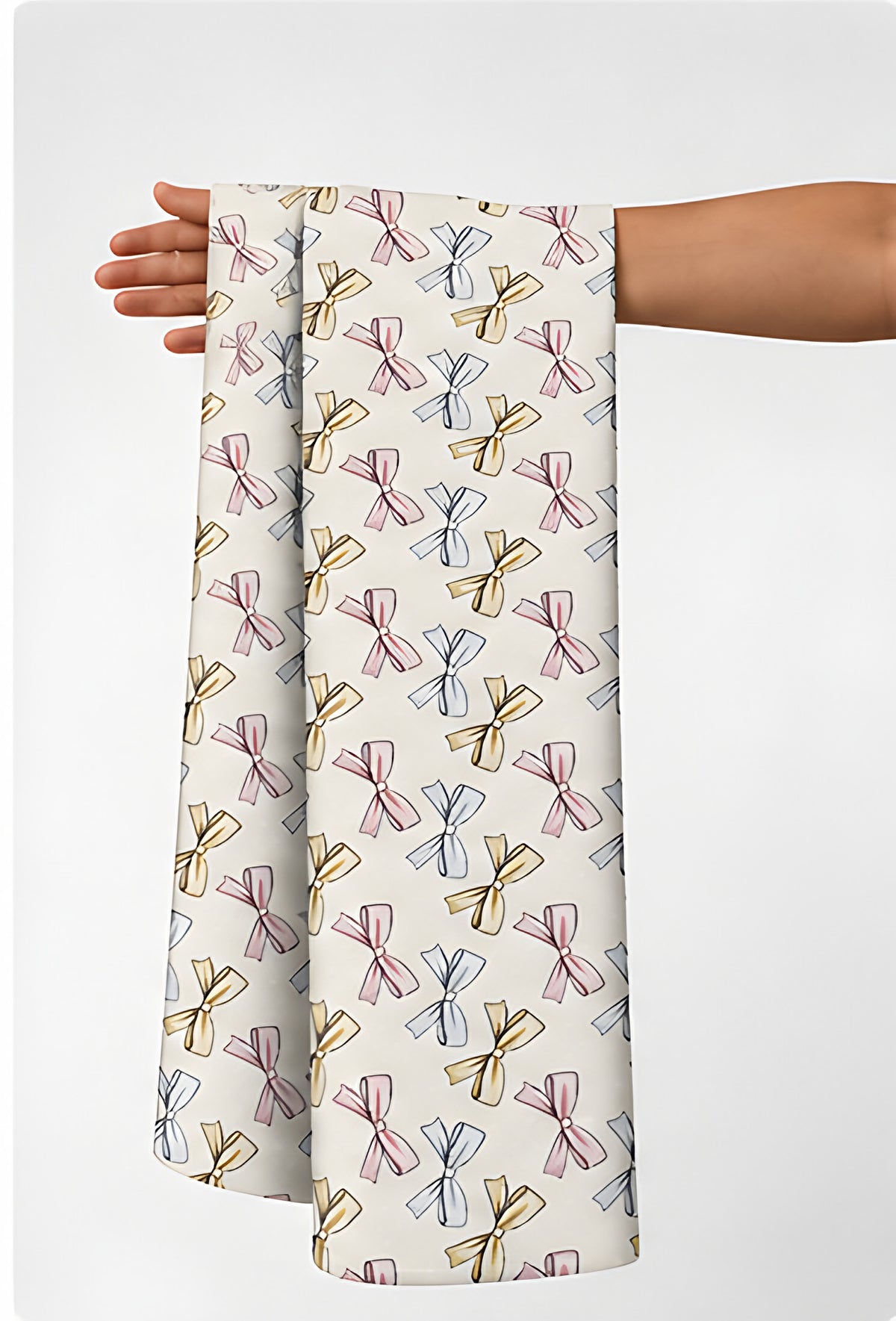 Cream Blue Repeating Motifs silk held in hand for scale